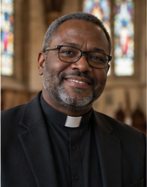 Minister in a clerical collar inside a church